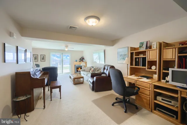 a spacious bedroom with a bed a couch and dresser