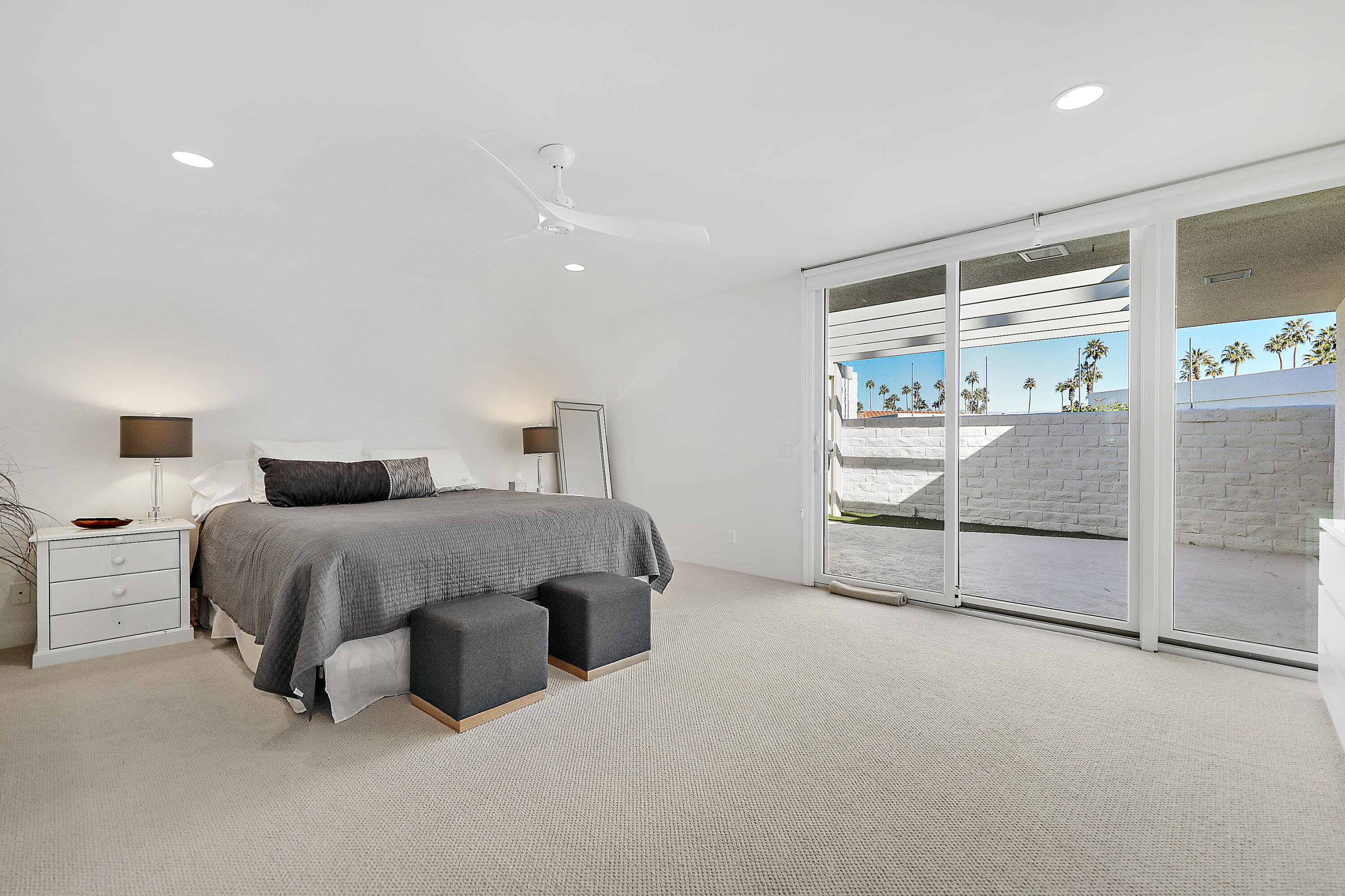 45705 Hopi Road Indian Wells, CA 92210 - Photo 11 of 25 a spacious bedroom with a bed and a large window