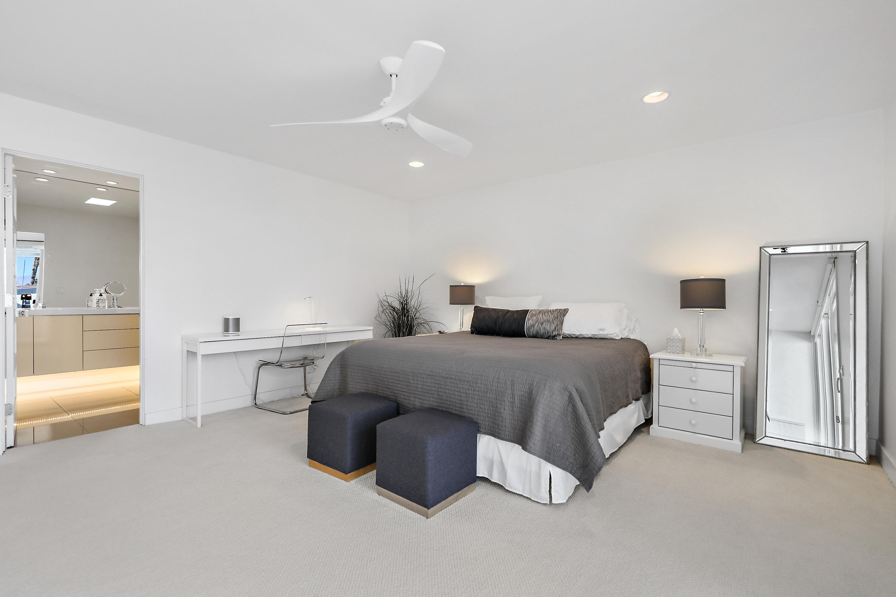 45705 Hopi Road Indian Wells, CA 92210 - Photo 12 of 25 a spacious bedroom with a bed and a view of cabinet