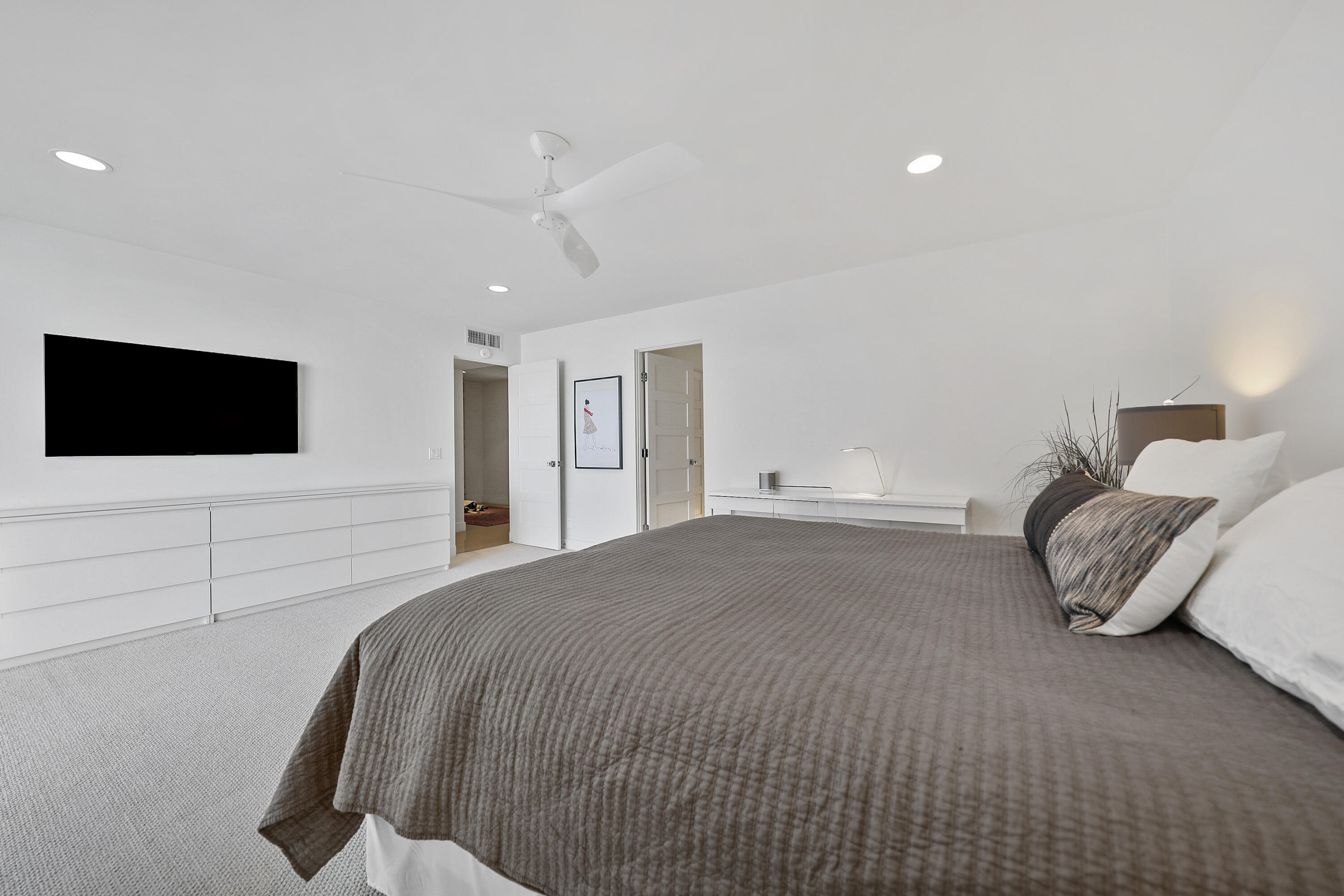 45705 Hopi Road Indian Wells, CA 92210 - Photo 14 of 25 a spacious bedroom with a bed and a flat screen tv