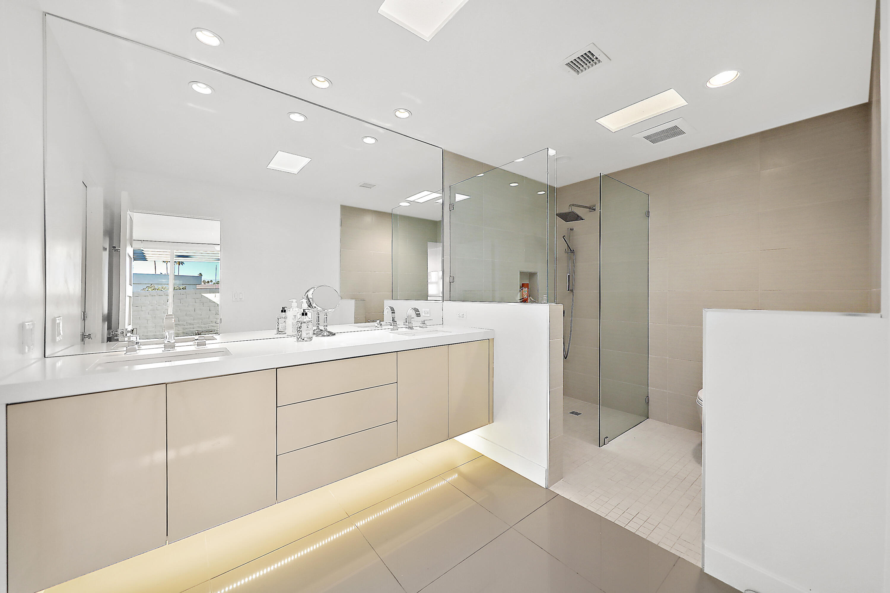 45705 Hopi Road Indian Wells, CA 92210 - Photo 15 of 25 a bathroom with a double vanity sink a mirror and a shower