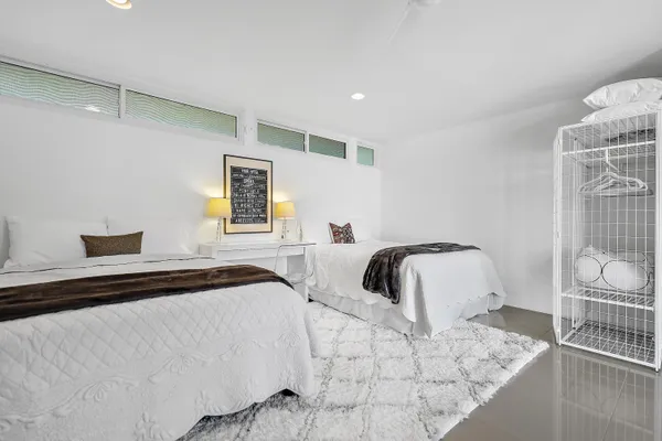 a bedroom with a bed and a couch