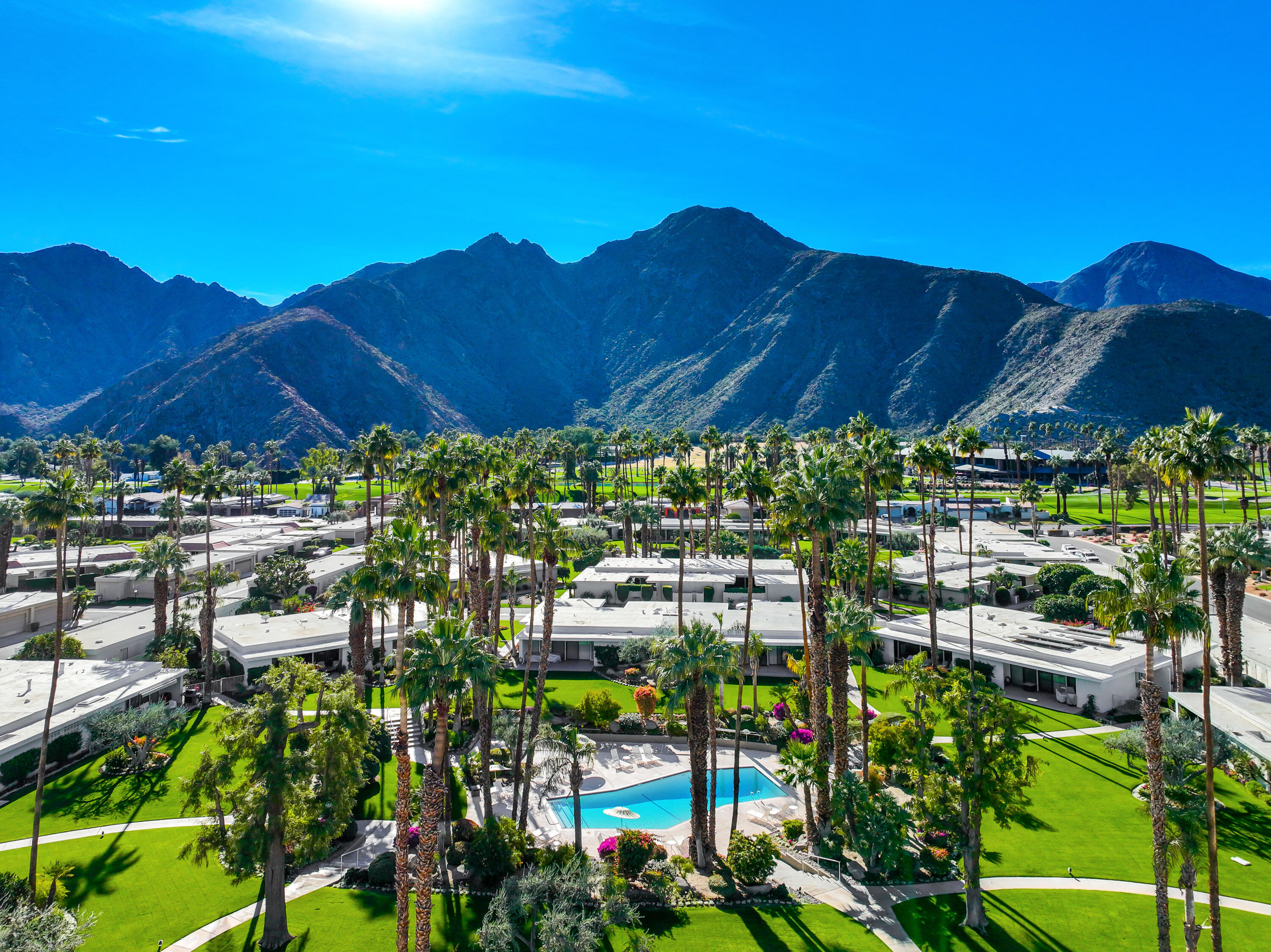 45705 Hopi Road Indian Wells, CA 92210 - Photo 21 of 25 a view of a patio and a table and chairs under an umbrella