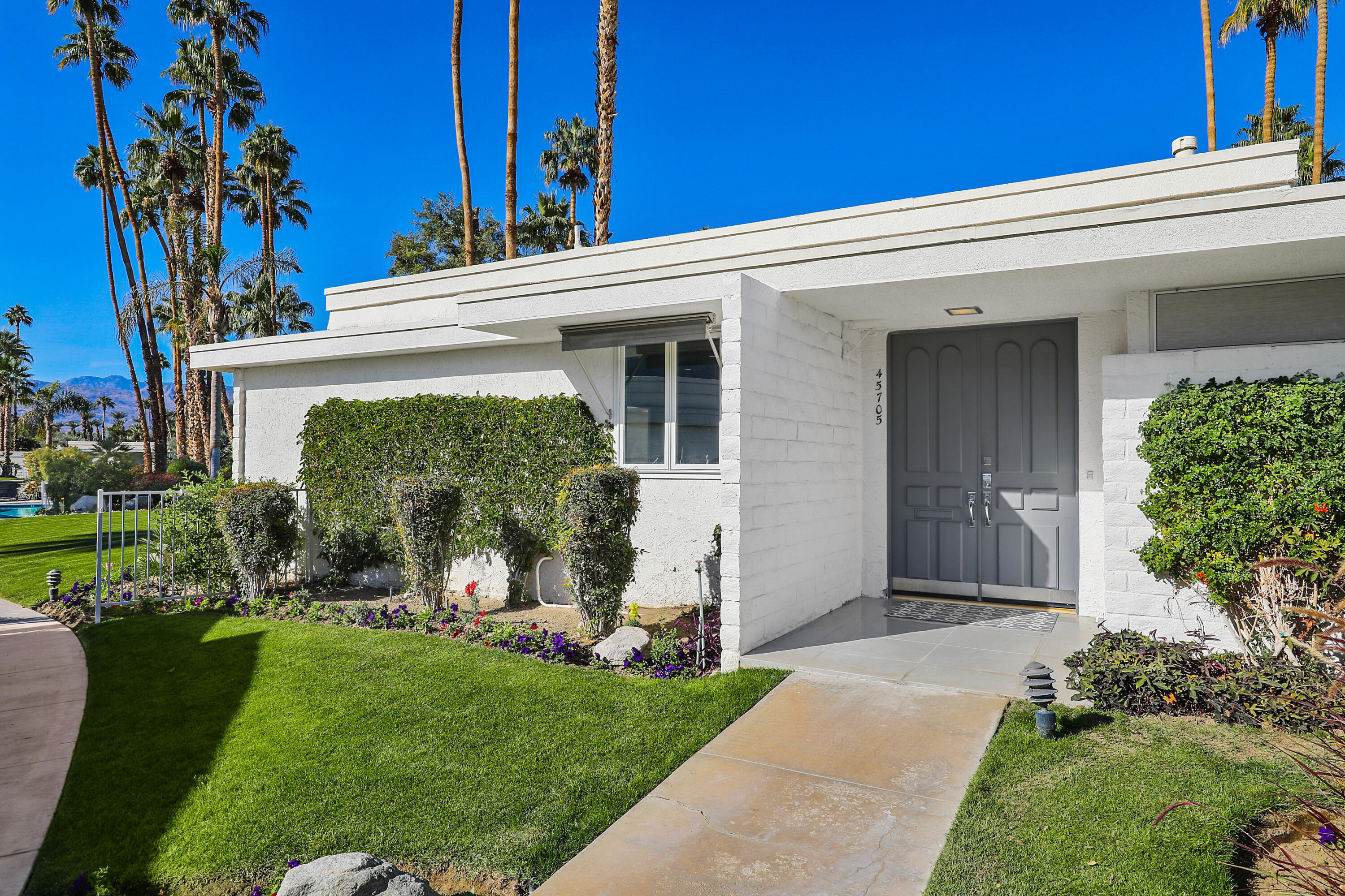 45705 Hopi Road Indian Wells, CA 92210 - Photo 23 of 25 a view of a house with a yard