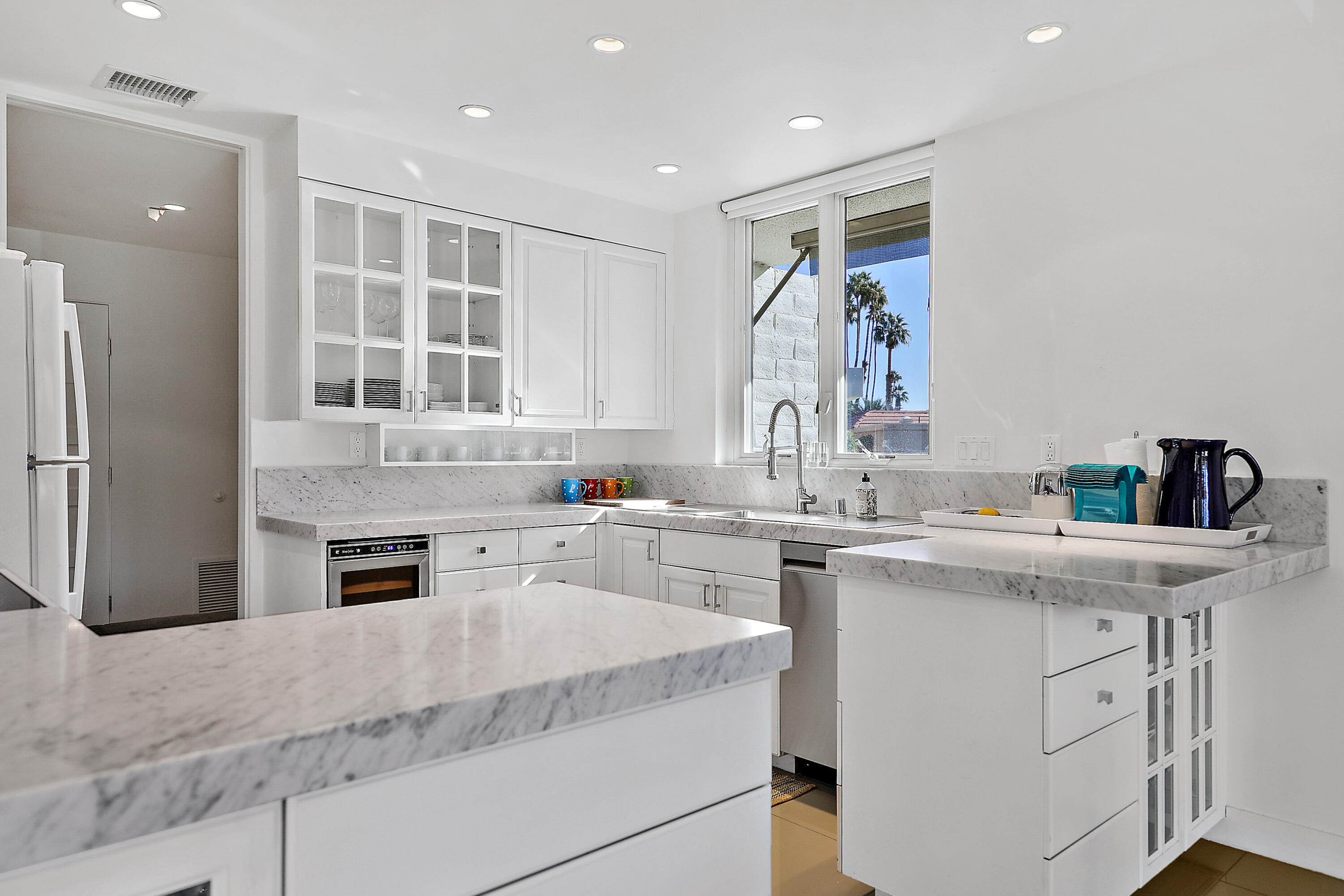 45705 Hopi Road Indian Wells, CA 92210 - Photo 4 of 25 a kitchen with a sink stove and refrigerator