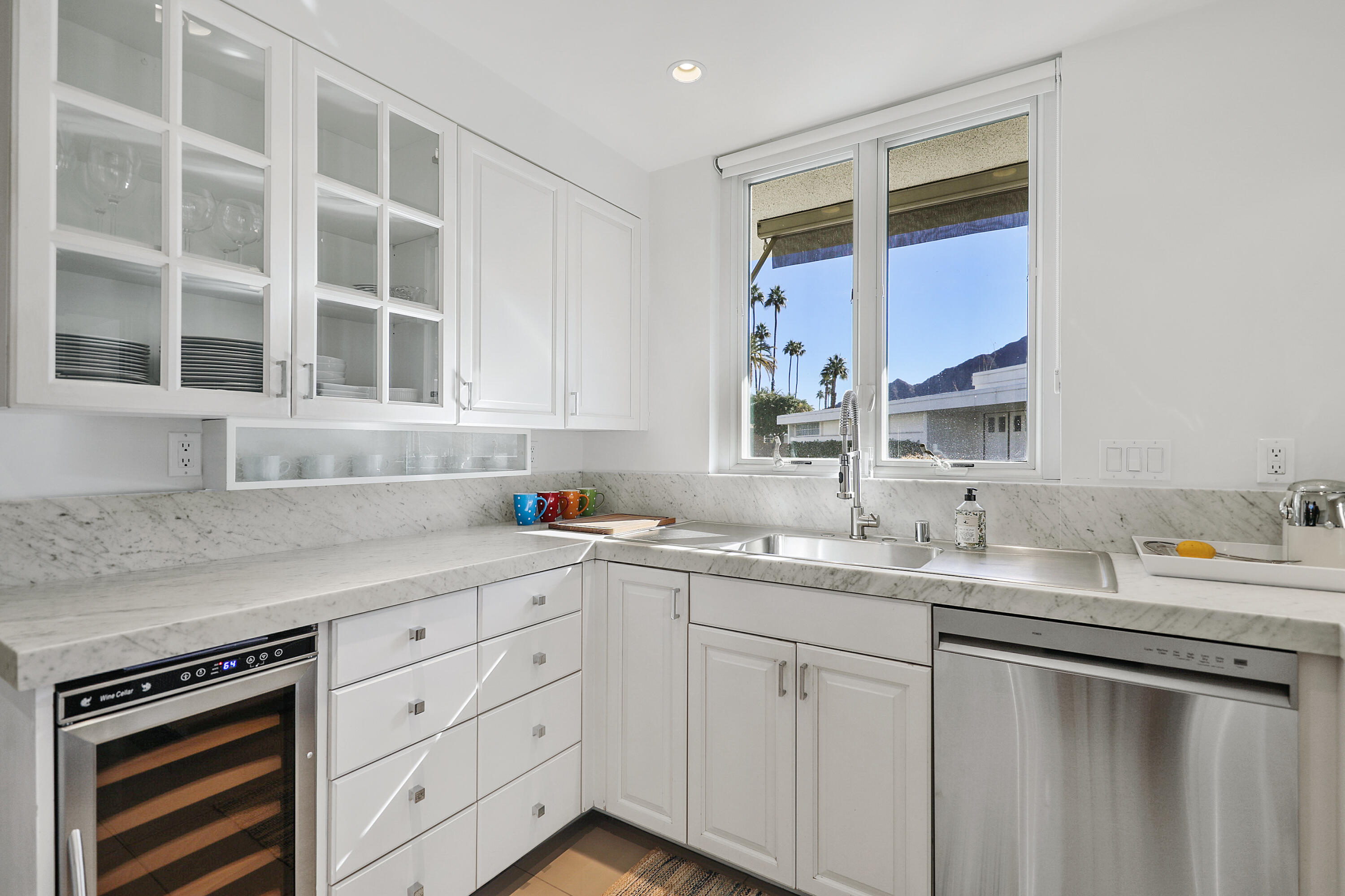 45705 Hopi Road Indian Wells, CA 92210 - Photo 6 of 25 a kitchen with a sink cabinets and window