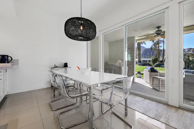 a view of a dining room and chandelier fan wooden floor and a chandelier