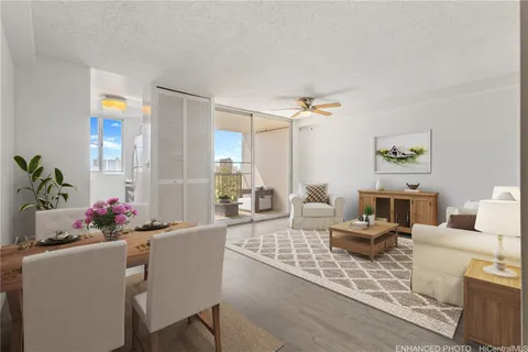 a living room with furniture and flowers