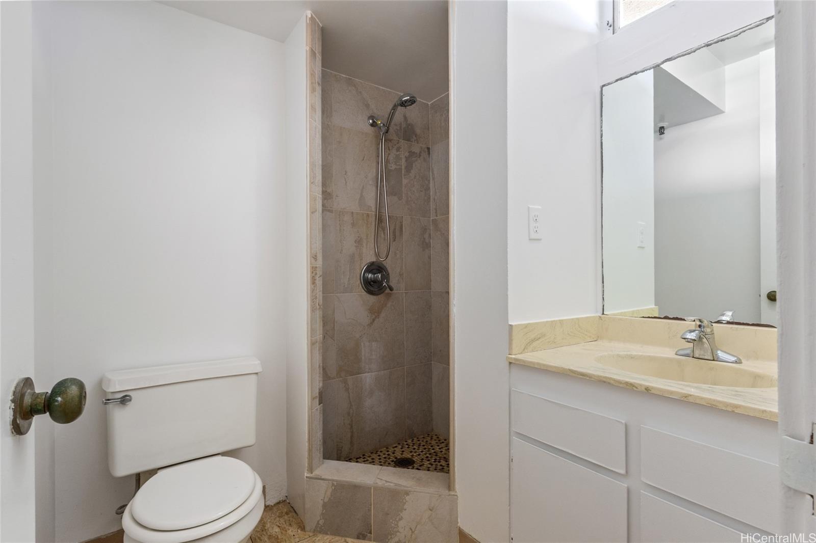 2916 Date Street, Unit 6G Honolulu, HI 96816 - Photo 8 of 20 a bathroom with a granite countertop sink toilet and shower