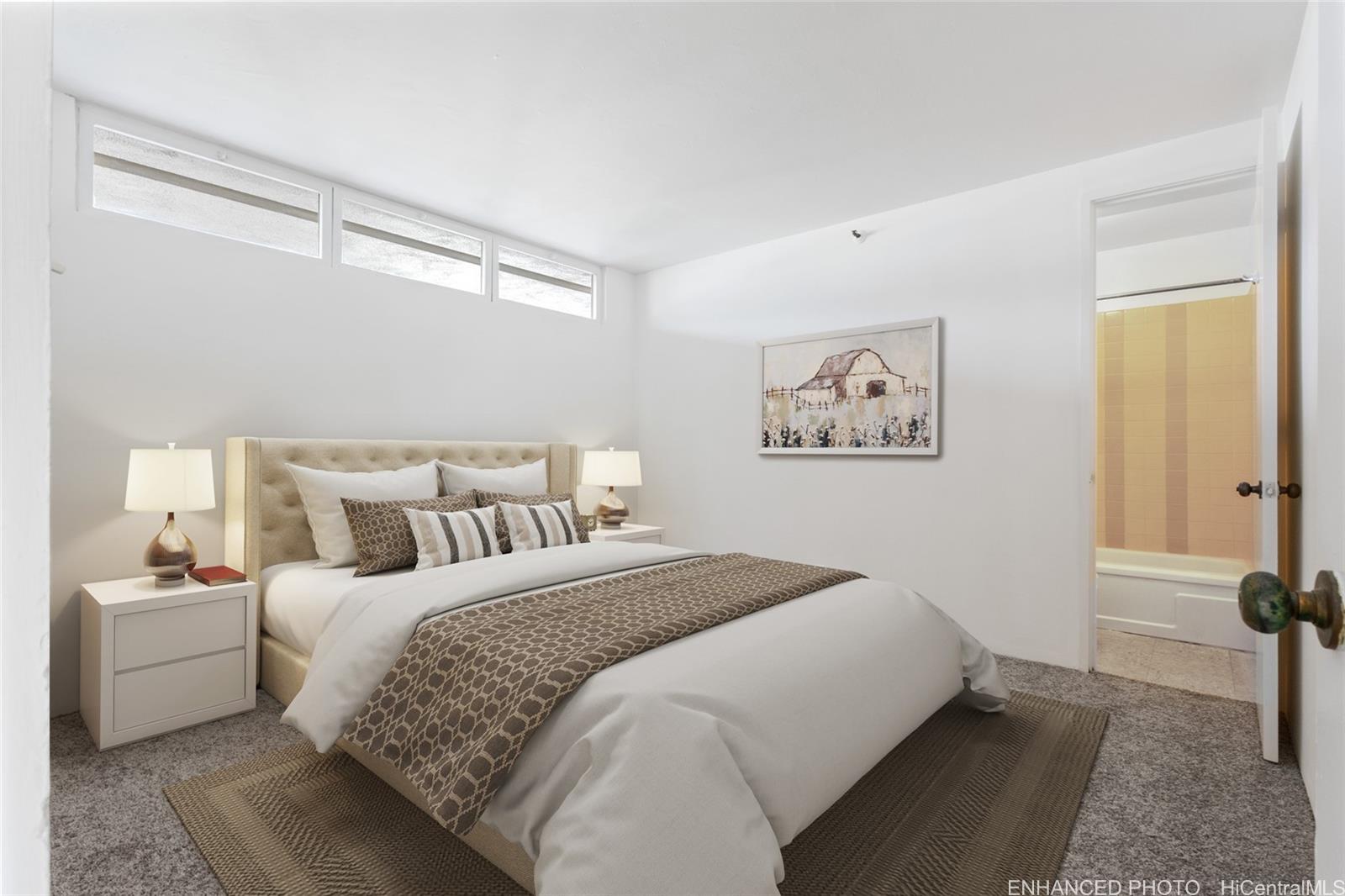 2916 Date Street, Unit 6G Honolulu, HI 96816 - Photo 9 of 20 a bedroom with a bed and a lamp on the dresser