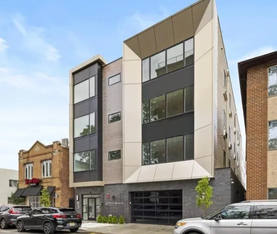 a front view of a building with glass windows