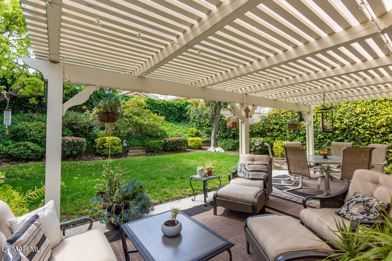 657 Galloping Hill Road Simi Valley, CA 93065 - Photo 23 of 34 a view of a patio with couches chairs and a table and chairs