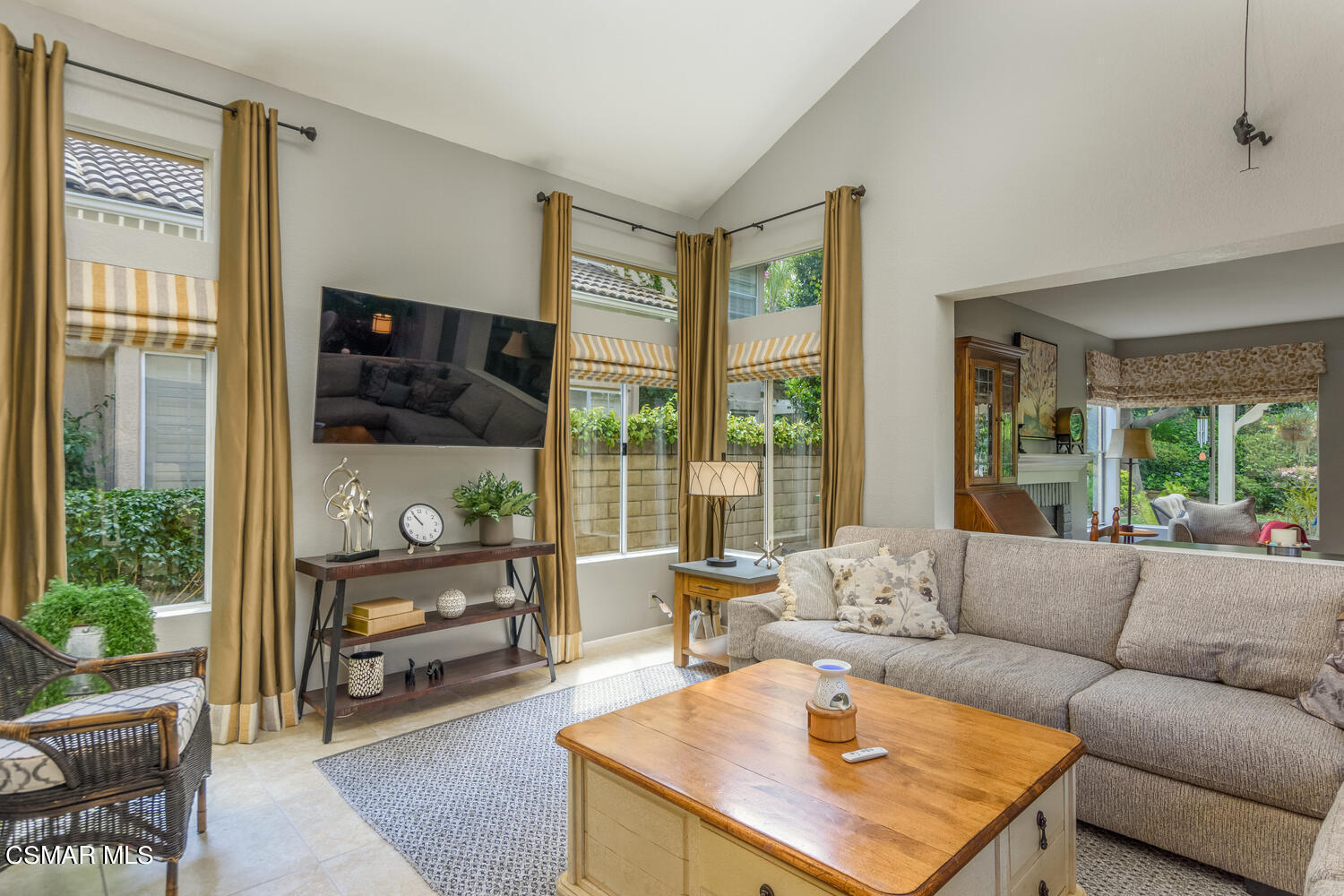 657 Galloping Hill Road Simi Valley, CA 93065 - Photo 4 of 34 a living room with furniture and a flat screen tv