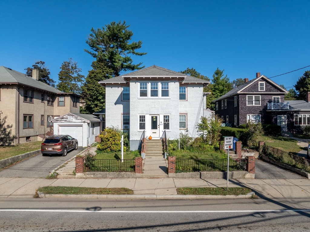 1625 Centre Street Newton, MA 02461 - Photo 1 of 8 a front view of a house with a garden