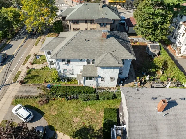 an aerial view of a house with yard swimming pool and outdoor seating