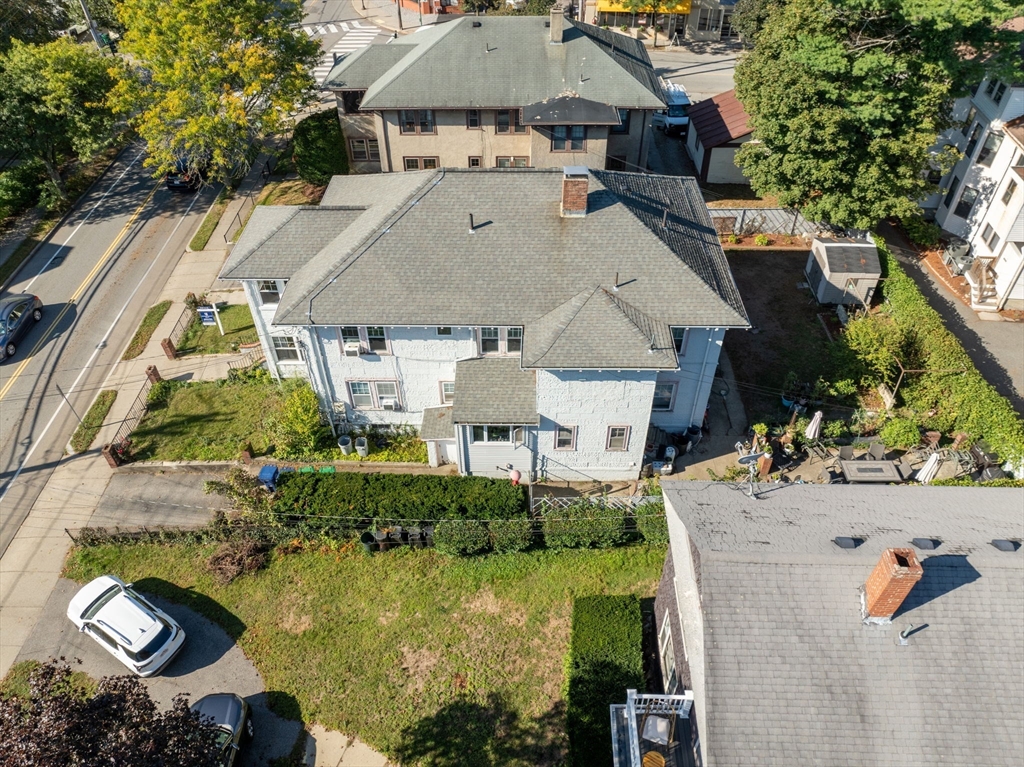 1625 Centre Street Newton, MA 02461 - Photo 6 of 8 an aerial view of a house with yard swimming pool and outdoor seating