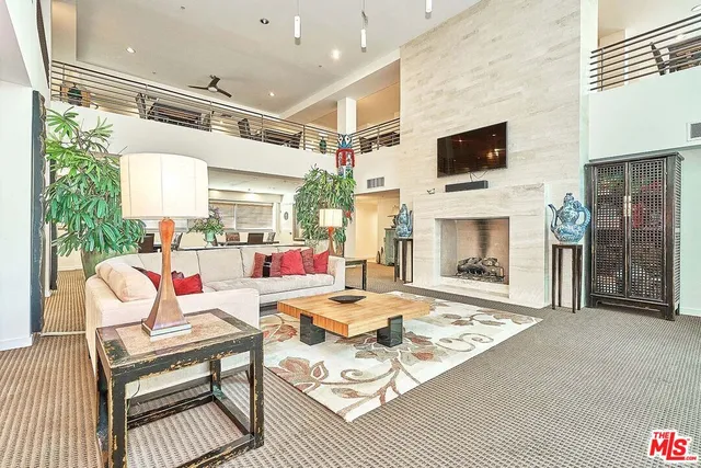 a outdoor space with furniture and a fireplace