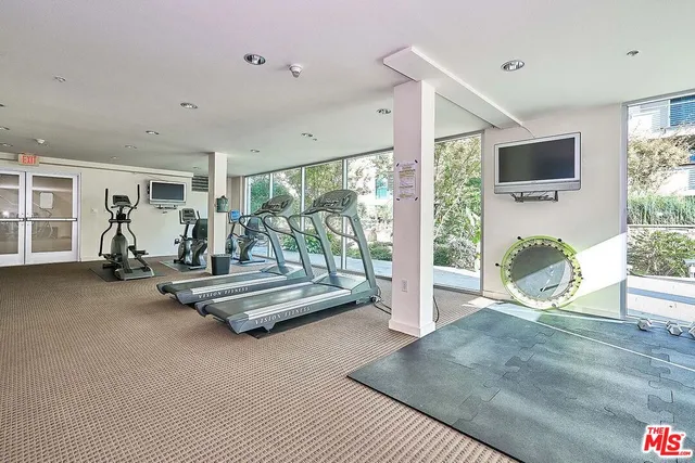 a view of a livingroom with furniture and a flat screen tv
