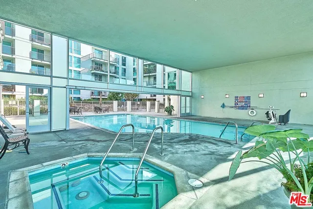 a view of a house with backyard porch and sitting area