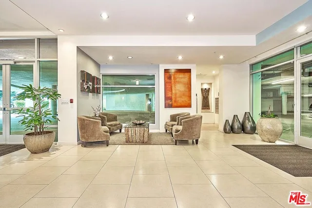 a lobby with furniture and window