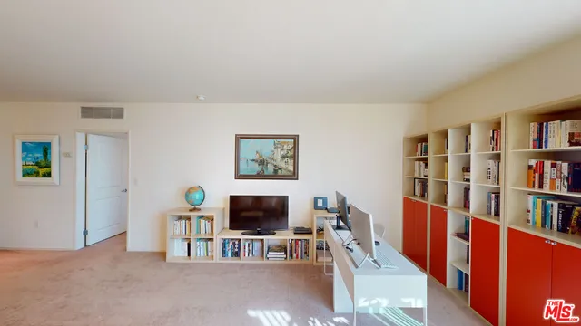 a living room with lots of furniture and a flat screen tv