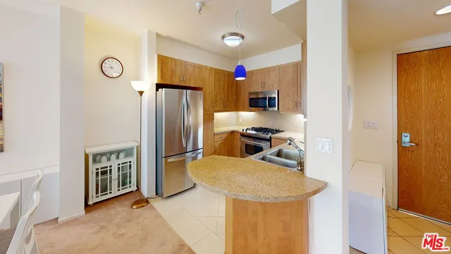 a kitchen with refrigerator cabinets and furniture