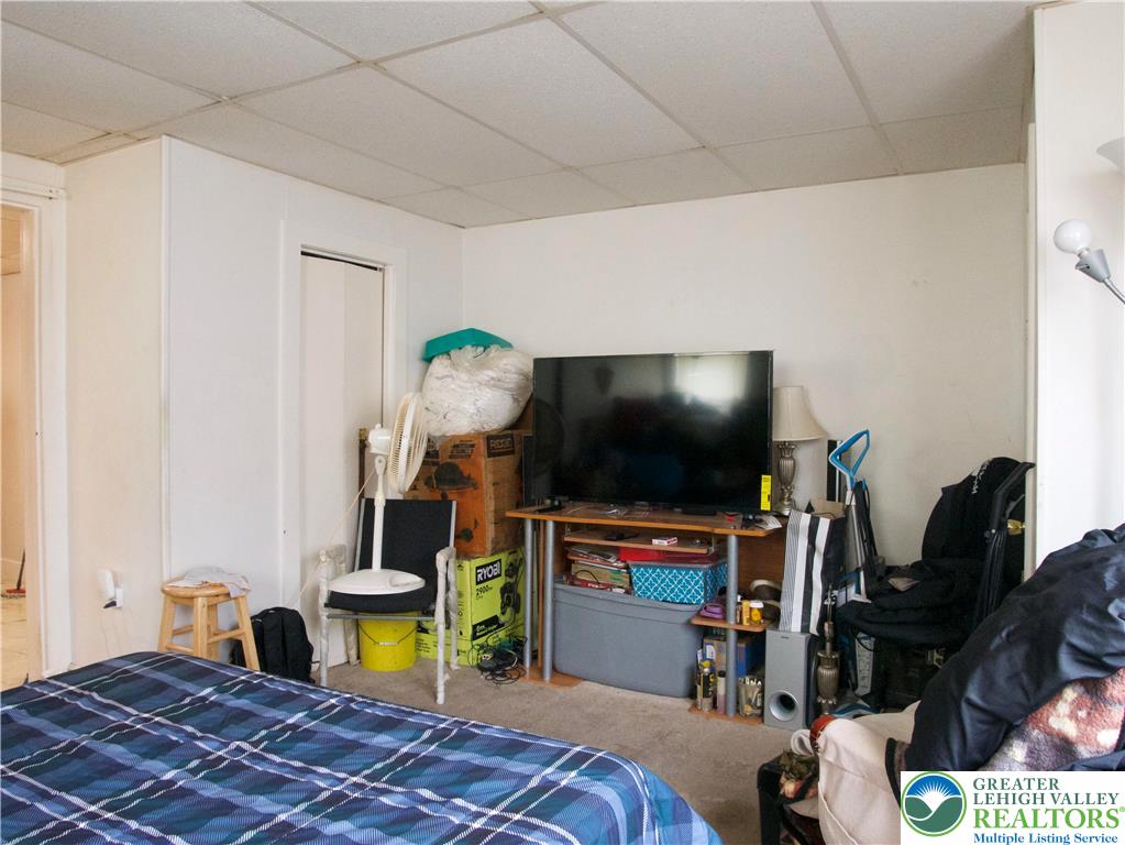 86 Garibaldi Avenue Roseto, PA 18013 - Photo 12 of 30 a bedroom with a bed and a flat screen tv