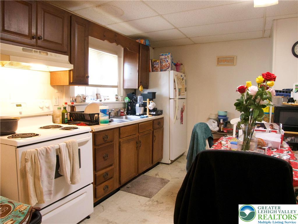 86 Garibaldi Avenue Roseto, PA 18013 - Photo 13 of 30 a kitchen with a sink stove and cabinets