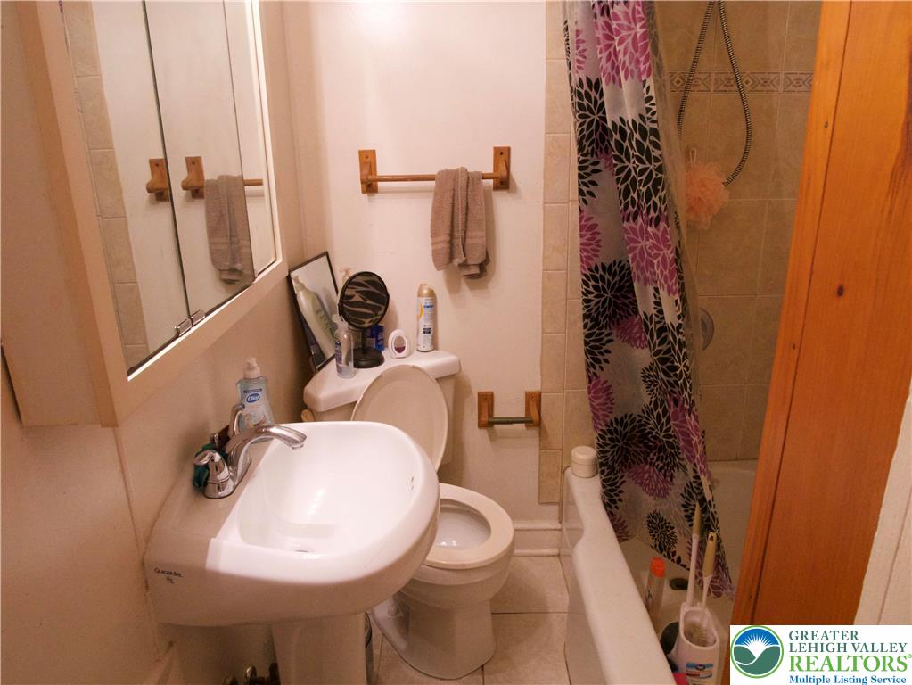 86 Garibaldi Avenue Roseto, PA 18013 - Photo 14 of 30 a bathroom with a toilet and a sink