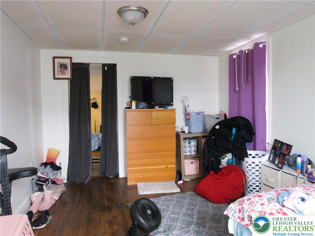 86 Garibaldi Avenue Roseto, PA 18013 - Photo 17 of 30 a bedroom with a bed and wooden floor