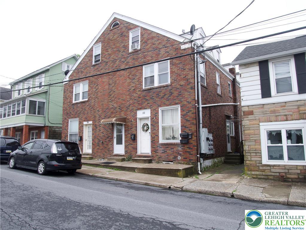 86 Garibaldi Avenue Roseto, PA 18013 - Photo 2 of 30 a couple of cars parked in front of a brick house