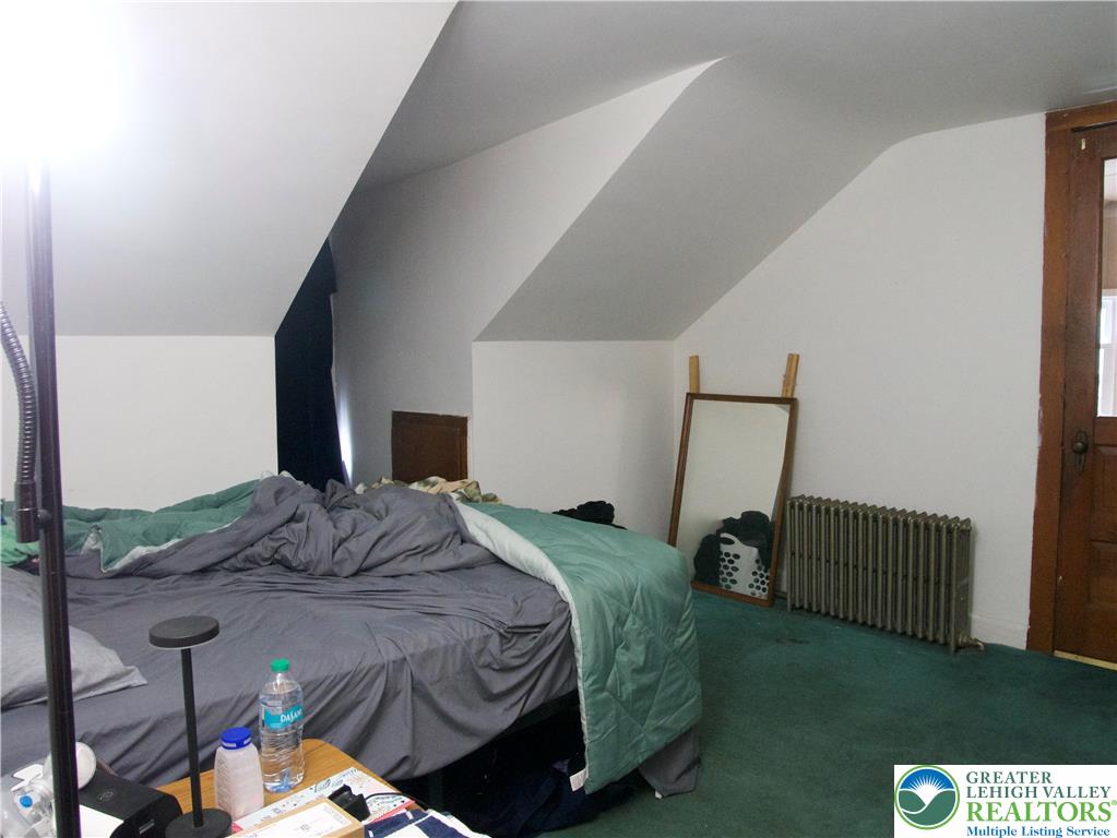 86 Garibaldi Avenue Roseto, PA 18013 - Photo 21 of 30 a bedroom with a bed and a mirror