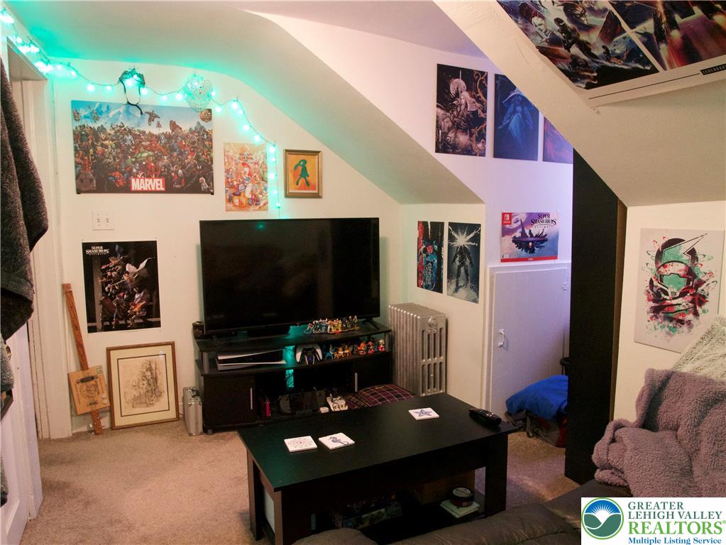 86 Garibaldi Avenue Roseto, PA 18013 - Photo 24 of 30 a living room with furniture and a flat screen tv