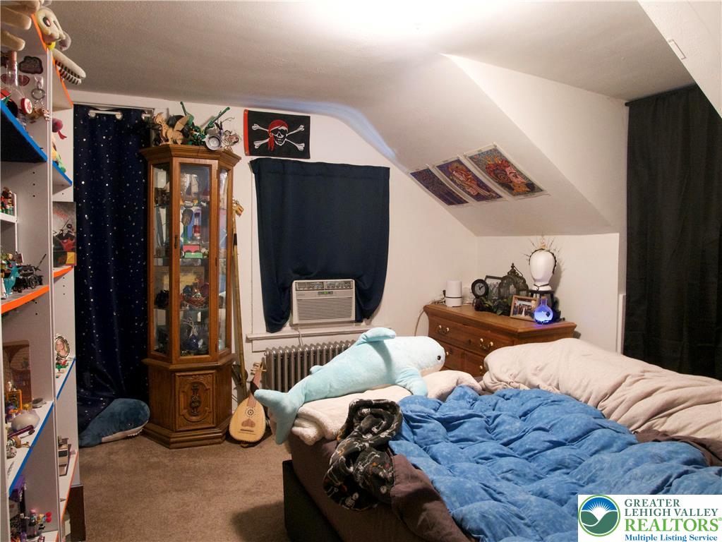 86 Garibaldi Avenue Roseto, PA 18013 - Photo 26 of 30 a bedroom with bed and wooden floor