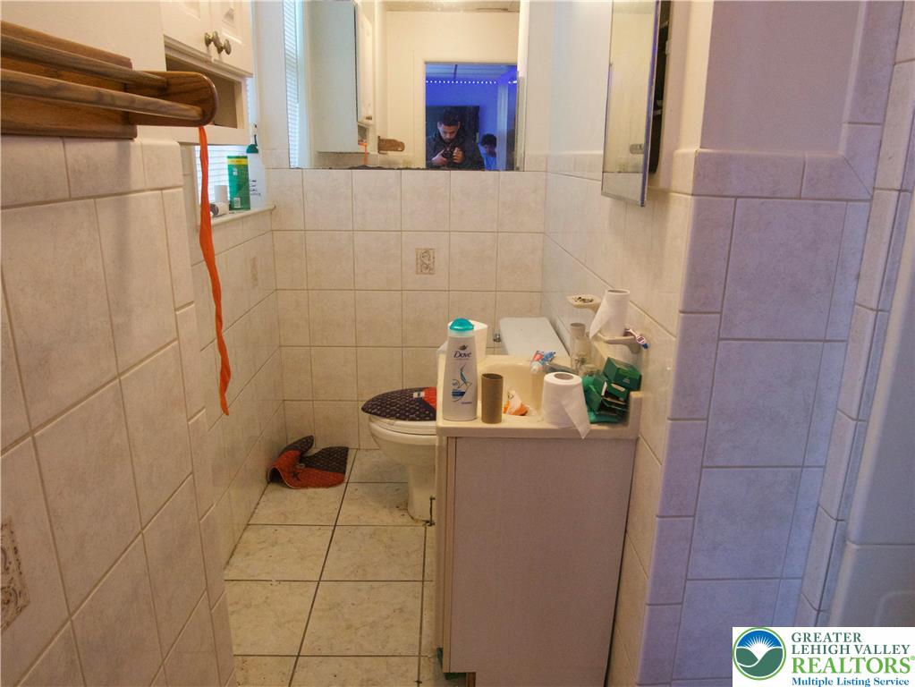 86 Garibaldi Avenue Roseto, PA 18013 - Photo 29 of 30 a bathroom with a sink and mirror