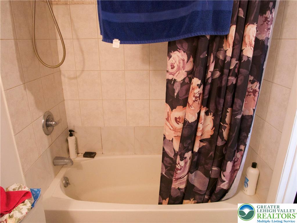 86 Garibaldi Avenue Roseto, PA 18013 - Photo 4 of 30 a bathroom with a bathtub and shower