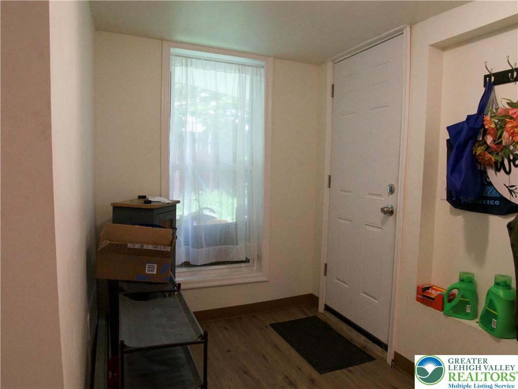 86 Garibaldi Avenue Roseto, PA 18013 - Photo 7 of 30 a view of a hallway with wooden floor and a window
