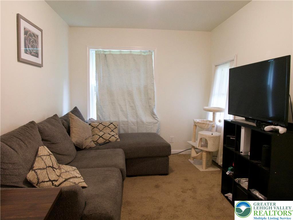 86 Garibaldi Avenue Roseto, PA 18013 - Photo 10 of 30 a living room with furniture and a flat screen tv
