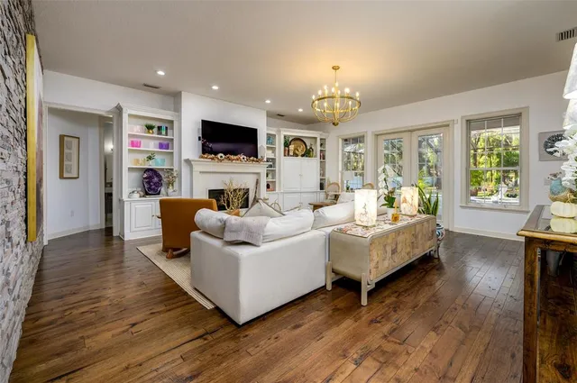 a living room with furniture fireplace and a flat screen tv