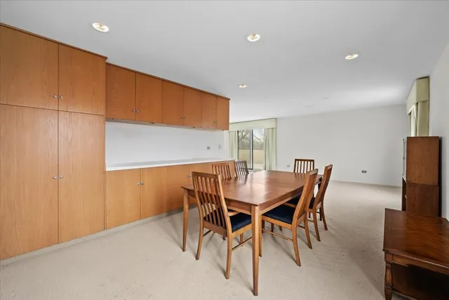 a kitchen with a sink a stove and cabinets