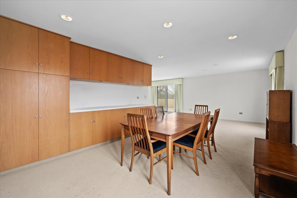1730 West Galena Boulevard, Unit 402E Aurora, IL 60506 - Photo 12 of 26 a view of a dining room with furniture