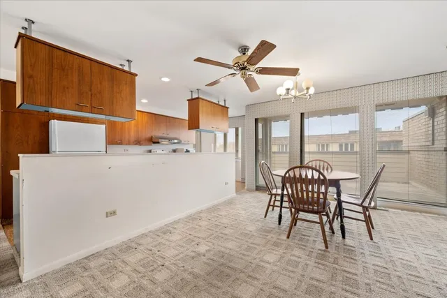 a kitchen with a refrigerator sink and stove