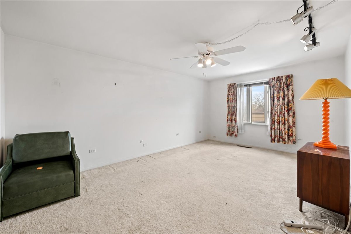 1730 West Galena Boulevard, Unit 402E Aurora, IL 60506 - Photo 23 of 26 wooden floor in an empty room with a window