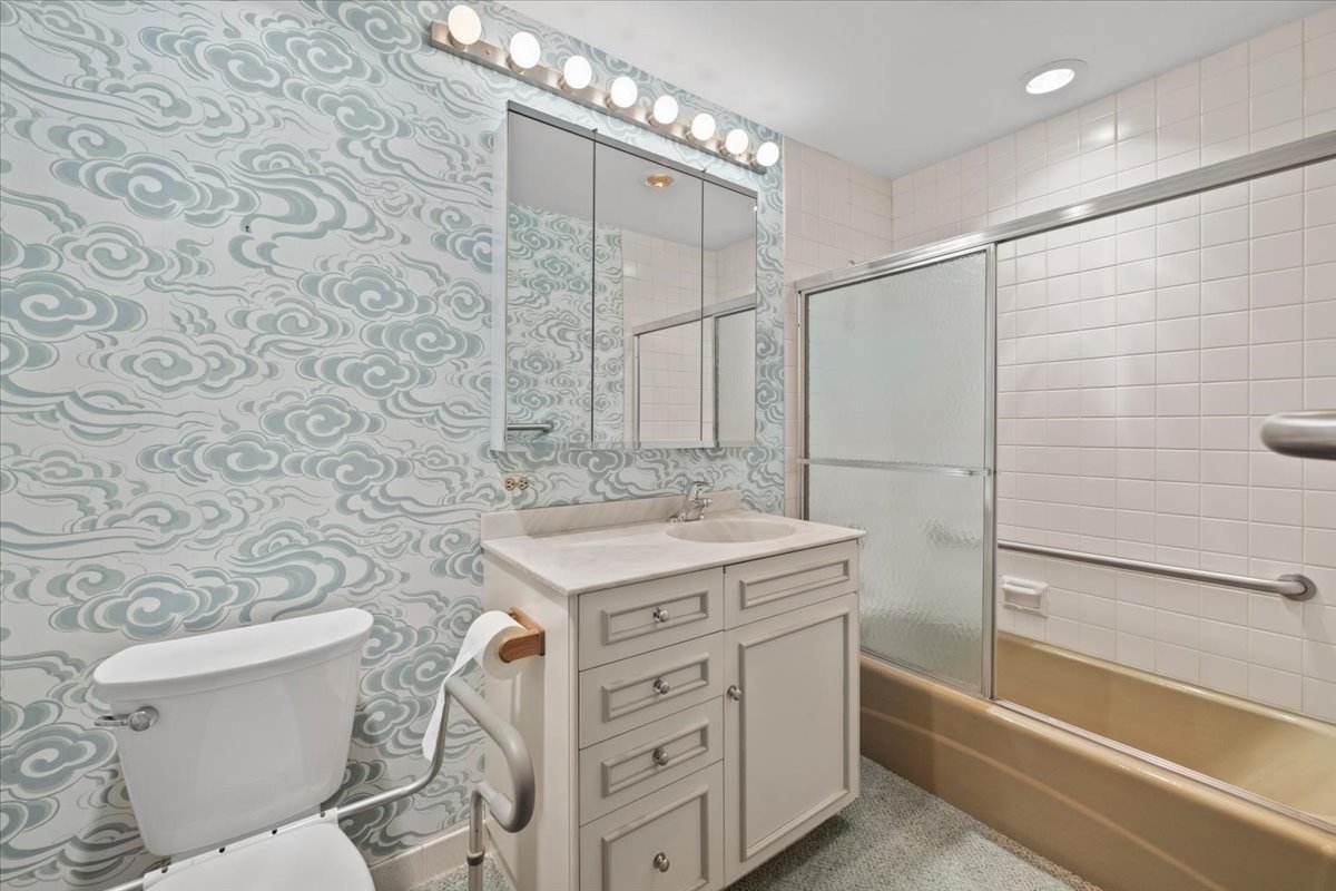 1730 West Galena Boulevard, Unit 402E Aurora, IL 60506 - Photo 24 of 26 a bathroom with a granite countertop sink toilet and shower