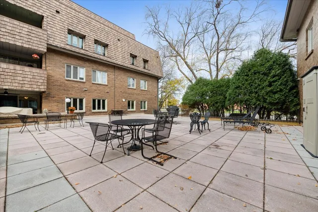 a view of backyard with sitting area
