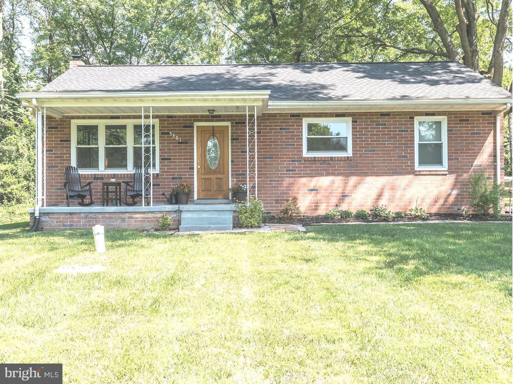 5301 Reels Mill Road Frederick, MD 21704 - Photo 3 of 22 a view of a house with a backyard and a table and chairs