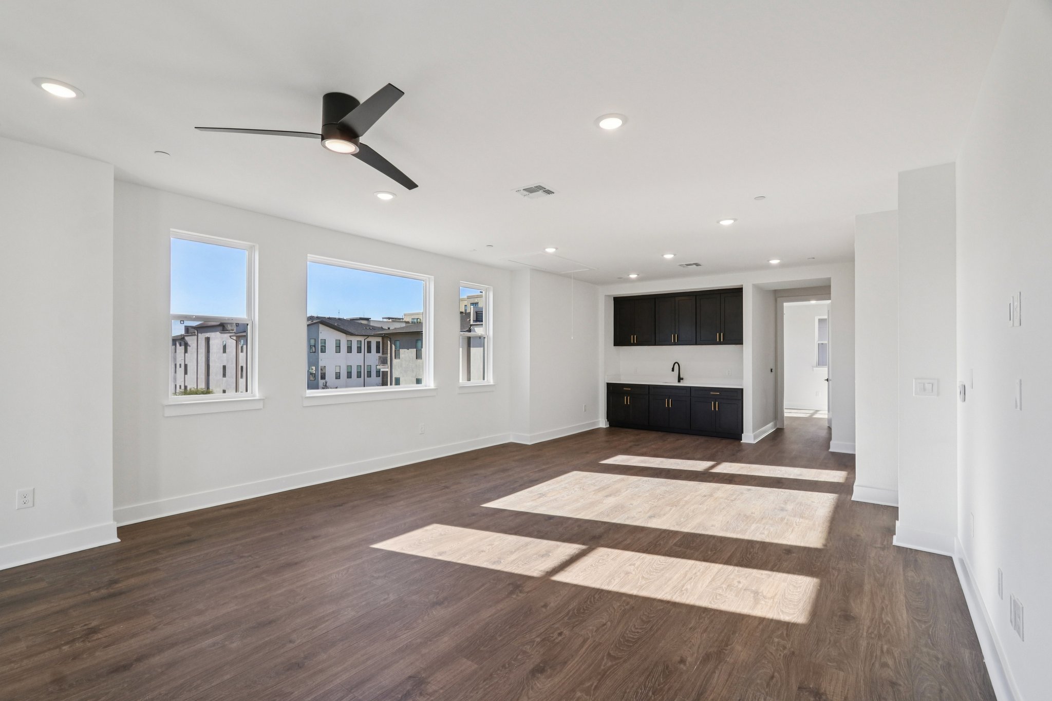4311 Prevail Lane Austin, TX 78731 - Photo 14 of 40 a view of an empty room with kitchen and window