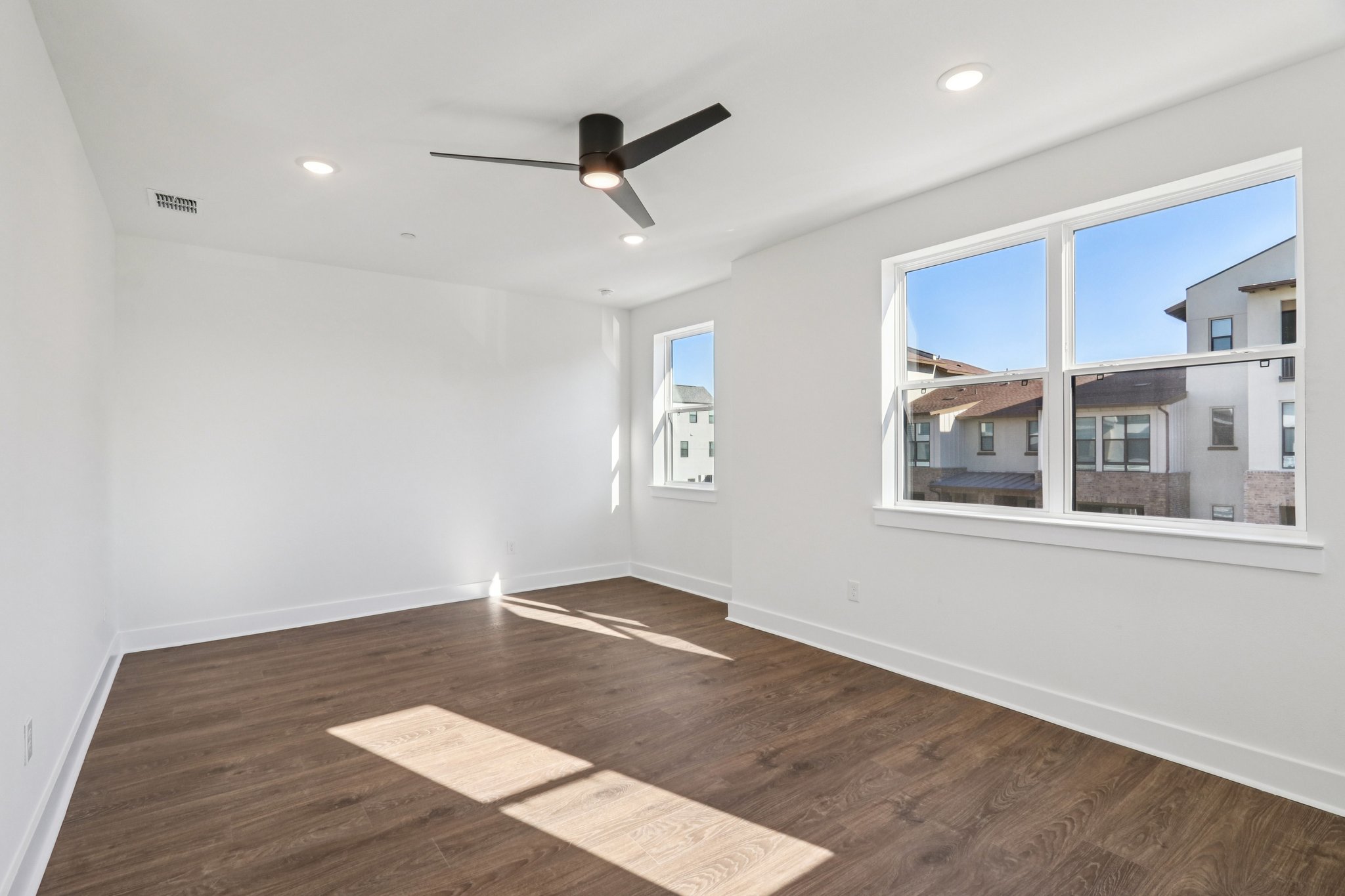 4311 Prevail Lane Austin, TX 78731 - Photo 15 of 40 a view of an empty room with a window and wooden floor