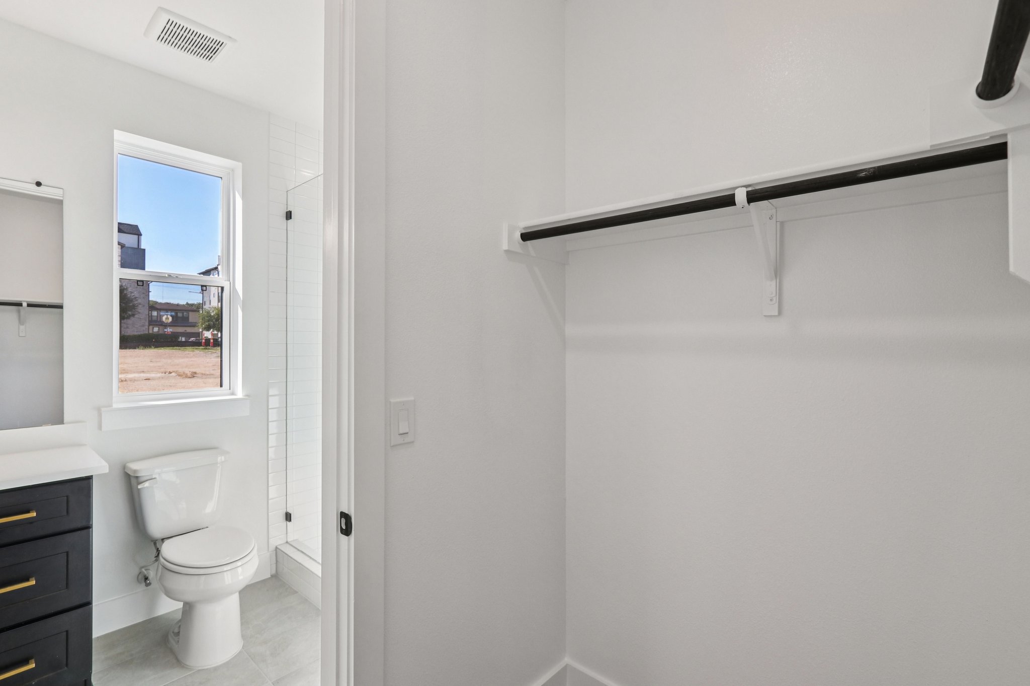4311 Prevail Lane Austin, TX 78731 - Photo 23 of 40 a bathroom with a toilet a sink and shower