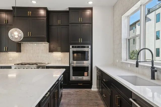a kitchen with a refrigerator and a sink